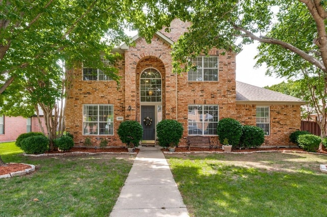 10557 Stargazer Dr, Frisco, TX 75033 - traditional-style house with brick siding and roof with shingles