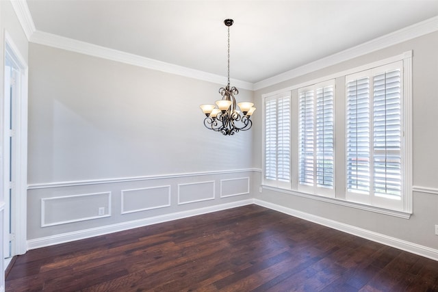 unfurnished dining area with dark wood-type flooring, a chandelier, crown molding, and baseboards