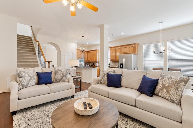409 Rosemont Ln, Fairview, TX 75069 - living area with a chandelier, wood finished floors, ceiling fan, arched walkways, and recessed lighting