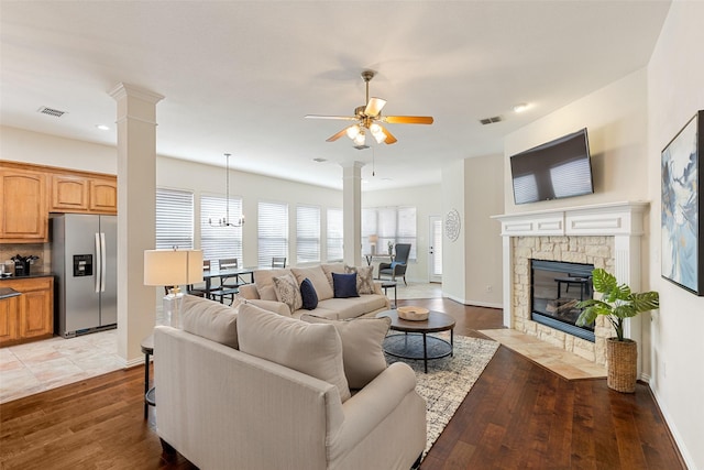 409 Rosemont Ln, Fairview, TX 75069 - living area with ornate columns, ceiling fan, a fireplace, healthy amount of natural light, and recessed lighting