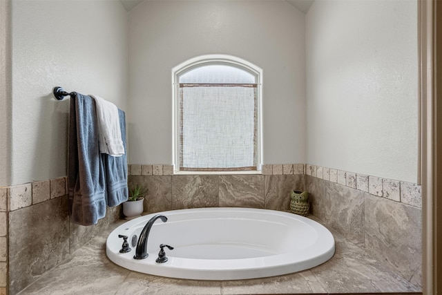 bathroom featuring a bath