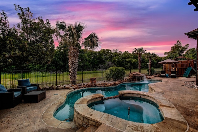 5250 Pueblo Ln, Frisco, TX 75034 - view of swimming pool featuring a patio area, a pool with connected hot tub, and a fenced backyard