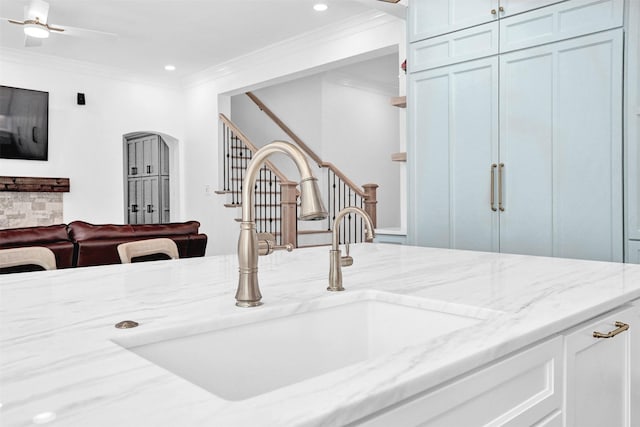 5250 Pueblo Ln, Frisco, TX 75034 - detailed view of a sink, crown molding, arched walkways, recessed lighting, and ceiling fan