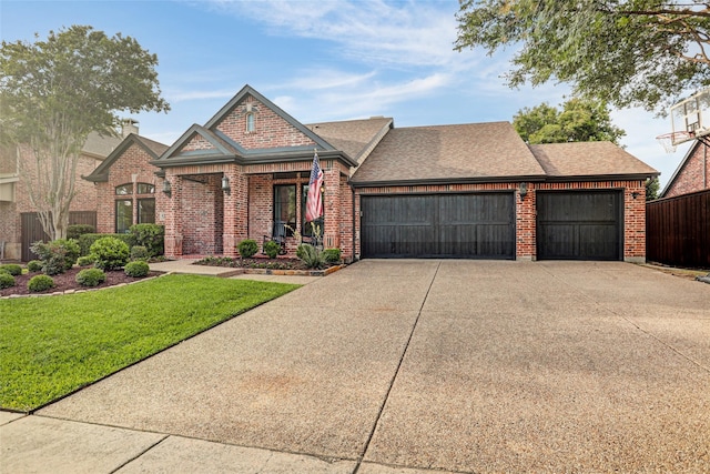 5250 Pueblo Ln, Frisco, TX 75034 - view of front facade featuring an attached garage, brick siding, concrete driveway, and roof with shingles