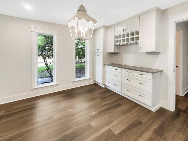 8 Woodmoor Cir, Lucas, TX 75002 - unfurnished dining area with baseboards, dark wood-style flooring, a chandelier, and recessed lighting