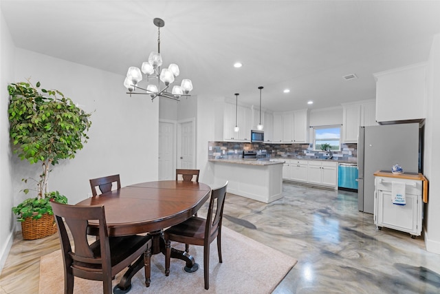 555 Advance Rd, Weatherford, TX 76088 - dining area featuring a chandelier, recessed lighting, and concrete flooring
