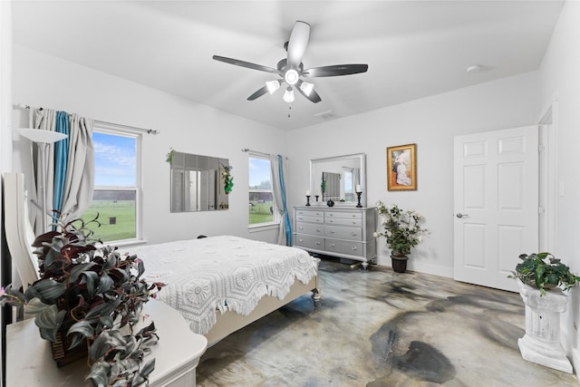 555 Advance Rd, Weatherford, TX 76088 - bedroom featuring finished concrete floors, ceiling fan, and baseboards