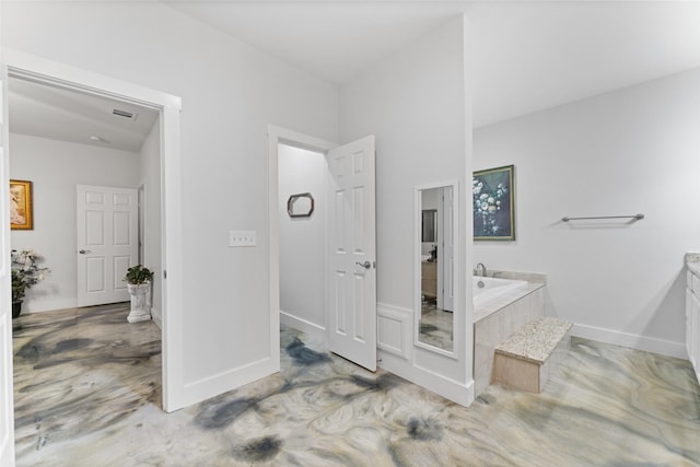 555 Advance Rd, Weatherford, TX 76088 - full bathroom with a garden tub, baseboards, and vanity