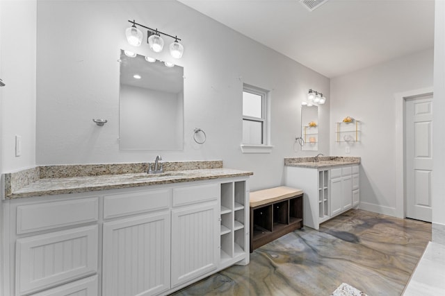 555 Advance Rd, Weatherford, TX 76088 - bathroom with two vanities and finished concrete flooring