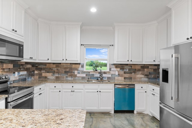 555 Advance Rd, Weatherford, TX 76088 - kitchen with stainless steel appliances, a sink, white cabinets, decorative backsplash, and ornamental molding