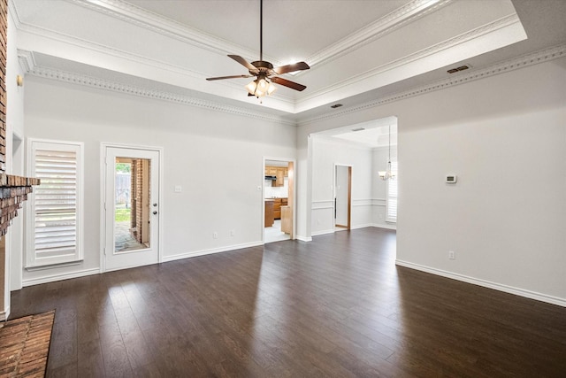 unfurnished living room with a ceiling fan, ornamental molding, dark wood-style floors, baseboards, and a tray ceiling