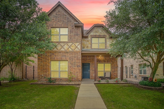 view of front of home featuring brick siding