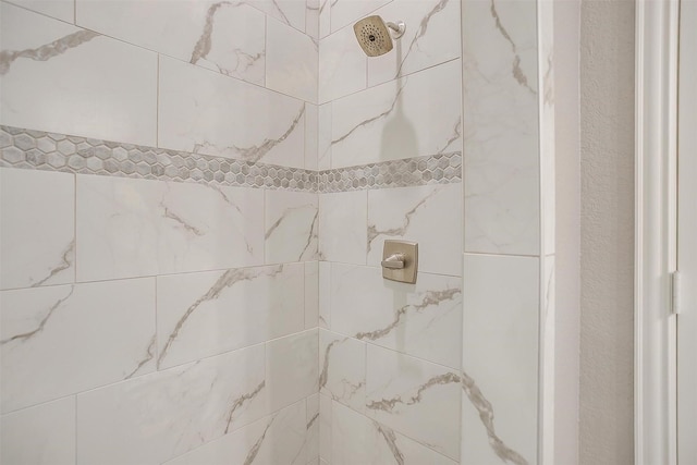 bathroom view of tiled shower