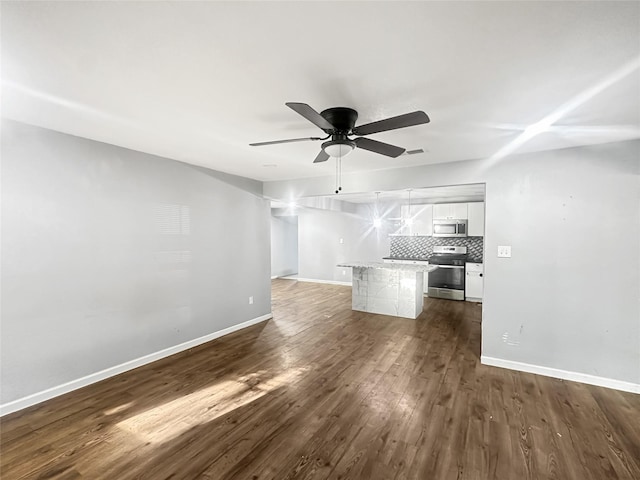 301 Mirike Dr, White Settlement, TX 76108 - unfurnished living room featuring a ceiling fan, dark wood-style floors, and baseboards