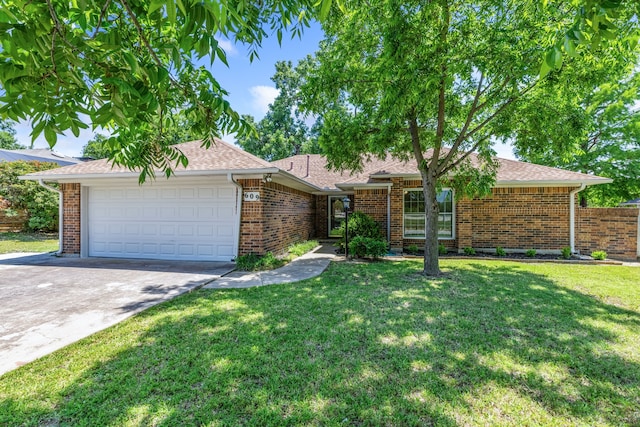 609 W Windsor Dr, Denton, TX 76207 - ranch-style home with a garage, driveway, and brick siding