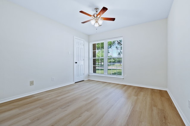 609 W Windsor Dr, Denton, TX 76207 - unfurnished room featuring light wood-style flooring, baseboards, and ceiling fan