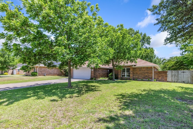 609 W Windsor Dr, Denton, TX 76207 - view of front of property with concrete driveway, an attached garage, and brick siding