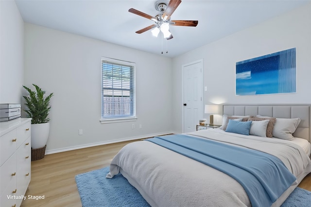 609 W Windsor Dr, Denton, TX 76207 - bedroom featuring light wood-type flooring, baseboards, and a ceiling fan