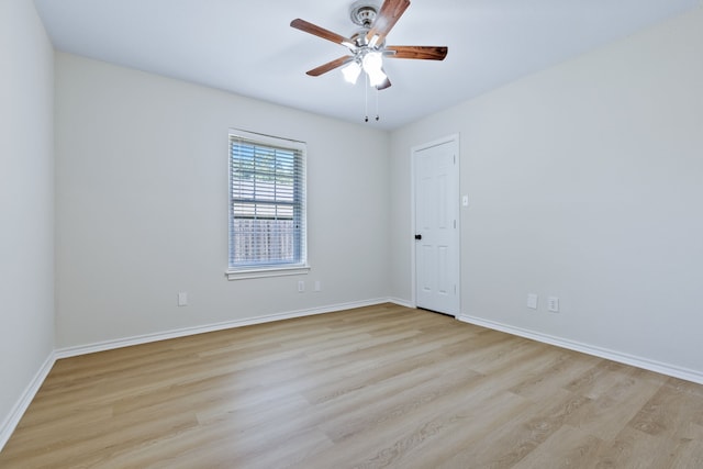 609 W Windsor Dr, Denton, TX 76207 - unfurnished room featuring wood finished floors, baseboards, and ceiling fan