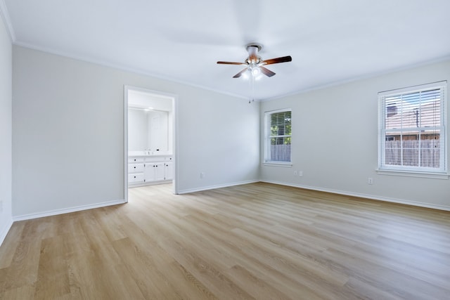 609 W Windsor Dr, Denton, TX 76207 - unfurnished room with a ceiling fan, light wood finished floors, baseboards, and crown molding