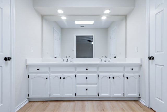 609 W Windsor Dr, Denton, TX 76207 - full bath with wood finished floors and double vanity