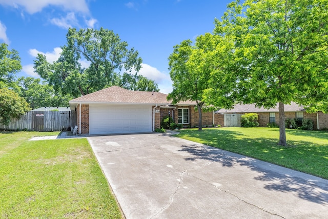 609 W Windsor Dr, Denton, TX 76207 - single story home featuring brick siding, a garage, concrete driveway, and roof with shingles