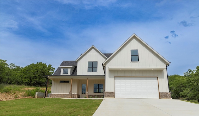 196 Jim Walter Dr, Runaway Bay, TX 76426 - modern farmhouse style home with driveway, a front yard, board and batten siding, and a porch