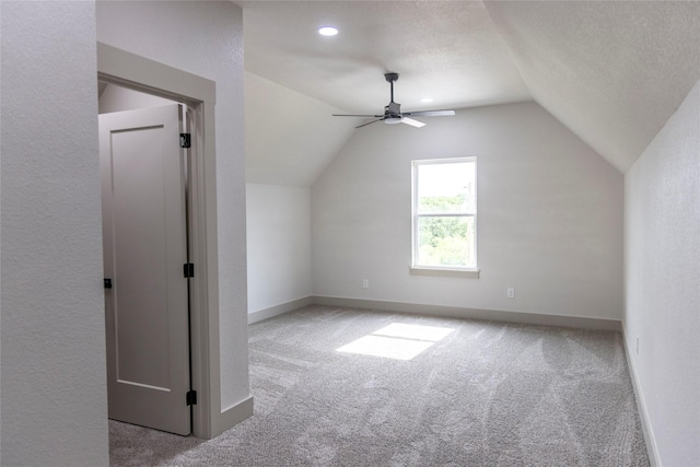 196 Jim Walter Dr, Runaway Bay, TX 76426 - bonus room with carpet flooring, vaulted ceiling, a ceiling fan, baseboards, and a textured ceiling