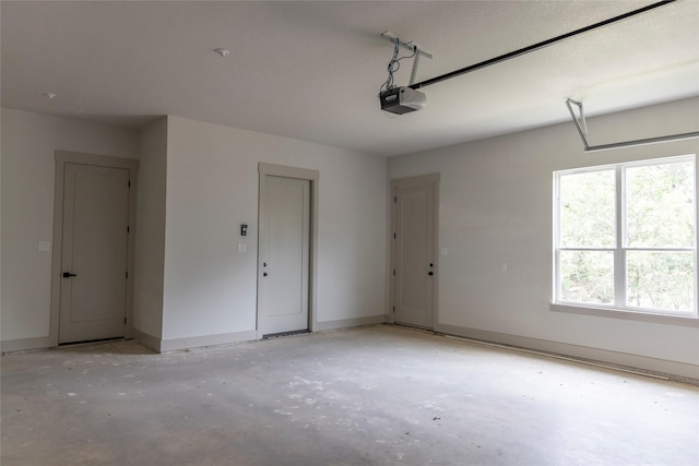 196 Jim Walter Dr, Runaway Bay, TX 76426 - garage featuring a garage door opener and baseboards