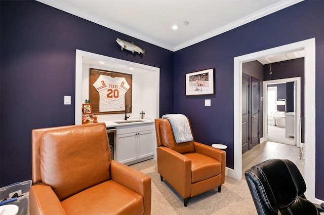 living area with light colored carpet, crown molding, baseboards, recessed lighting, and wet bar