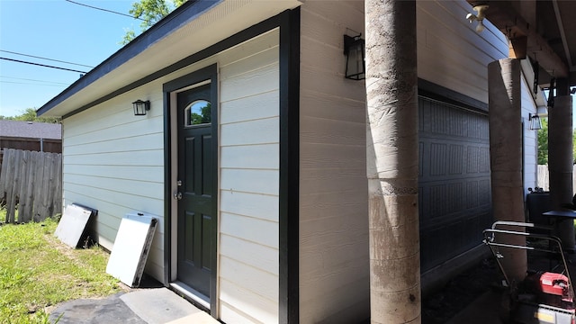 view of exterior entry with fence