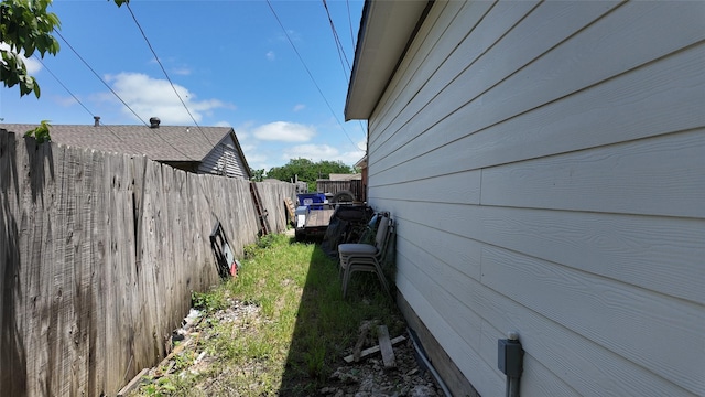 view of property exterior with fence