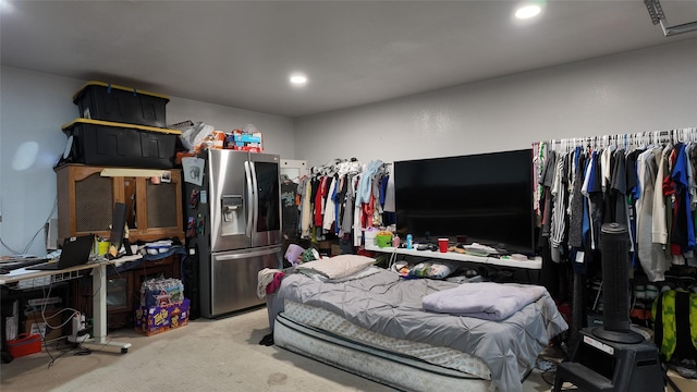 bedroom with stainless steel refrigerator with ice dispenser, light colored carpet, and recessed lighting
