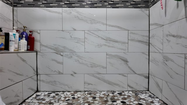 bathroom view of tiled shower