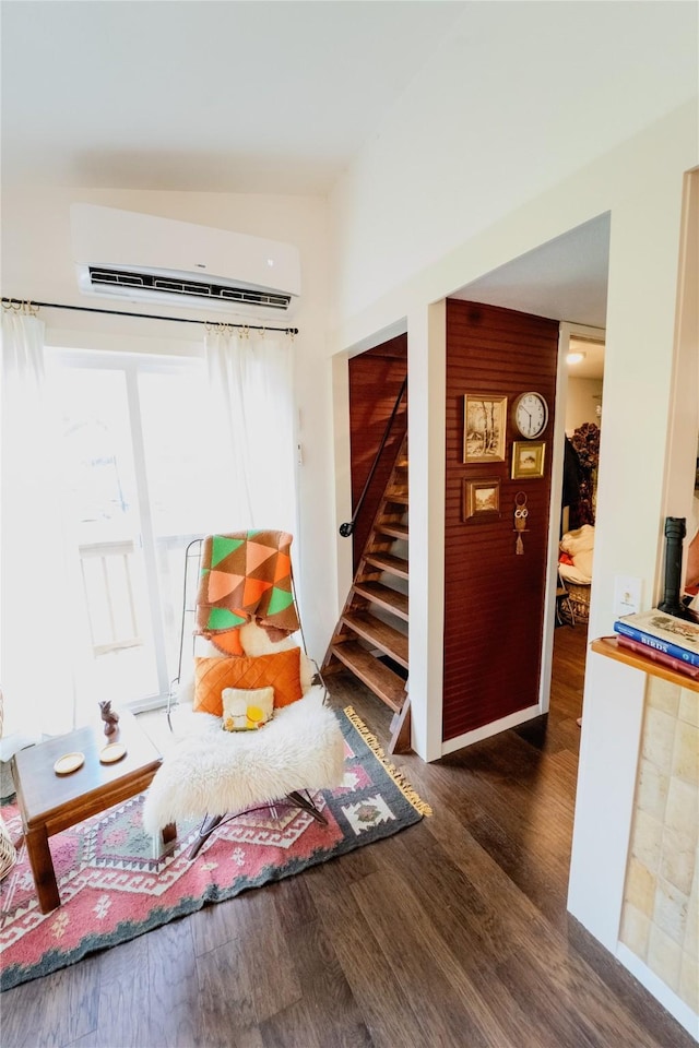 7006 Horseshoe Bend Trl, Weatherford, TX 76087 - living room featuring an AC wall unit, wood finished floors, and stairway