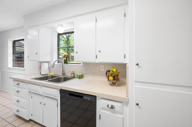 1710 Windsor Dr, Arlington, TX 76012 - kitchen featuring black dishwasher, a sink, white cabinetry, light countertops, and light tile patterned floors