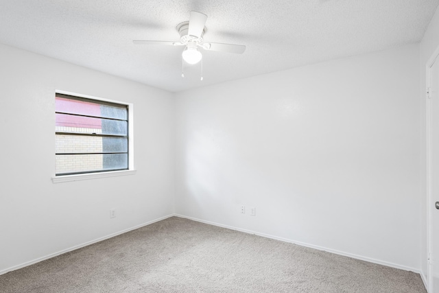 1710 Windsor Dr, Arlington, TX 76012 - unfurnished room with carpet, ceiling fan, a textured ceiling, and baseboards