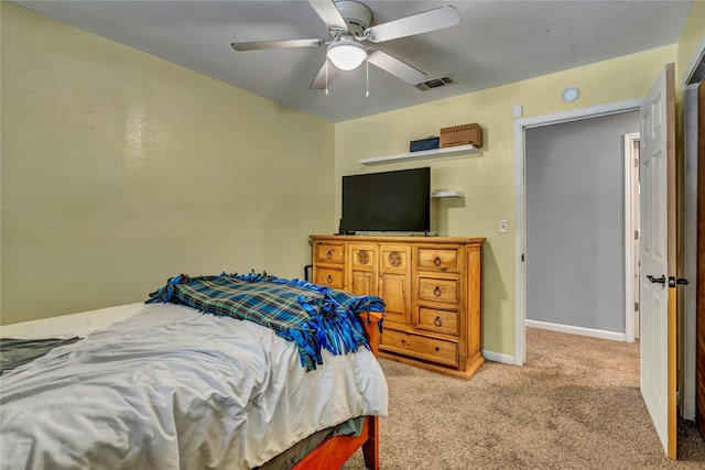116 Nottingham Cir, Bridgeport, TX 76426 - bedroom with light colored carpet, baseboards, and a ceiling fan