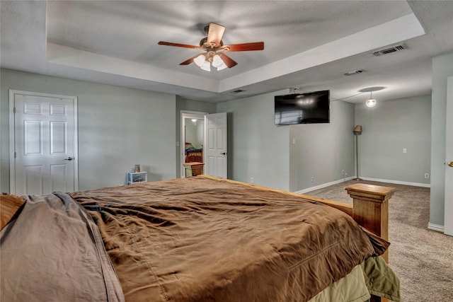 116 Nottingham Cir, Bridgeport, TX 76426 - bedroom featuring a raised ceiling, carpet flooring, baseboards, and ceiling fan