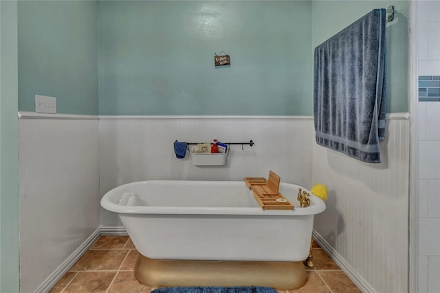 116 Nottingham Cir, Bridgeport, TX 76426 - full bath with a soaking tub, wainscoting, and tile patterned floors