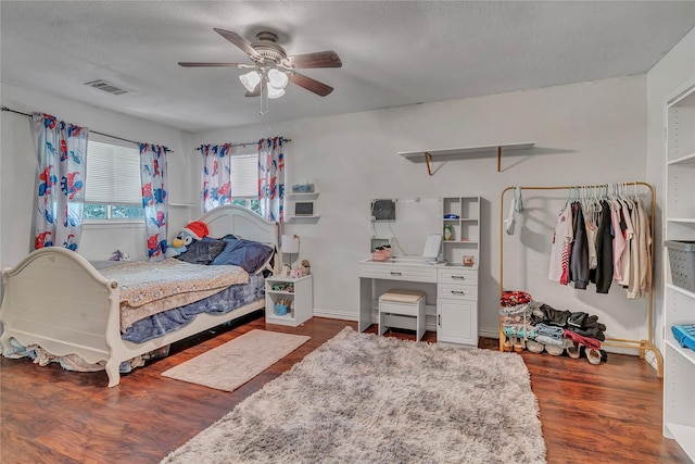 116 Nottingham Cir, Bridgeport, TX 76426 - bedroom with wood finished floors, a ceiling fan, and baseboards