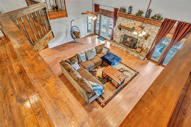 116 Nottingham Cir, Bridgeport, TX 76426 - living area with wood finished floors, stairs, and healthy amount of natural light
