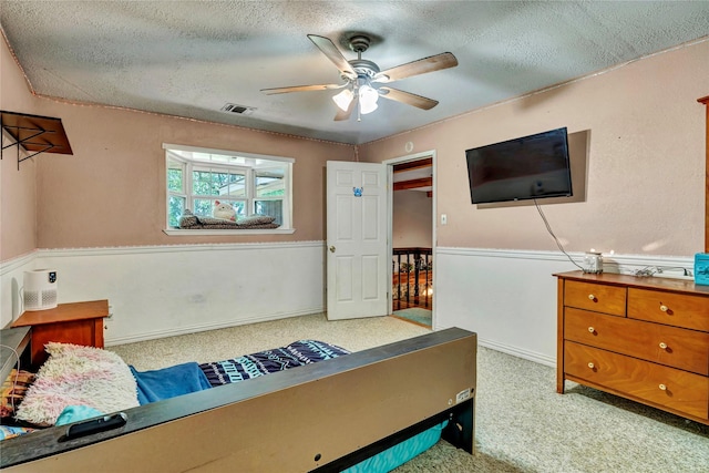 116 Nottingham Cir, Bridgeport, TX 76426 - carpeted bedroom with a textured ceiling and a ceiling fan