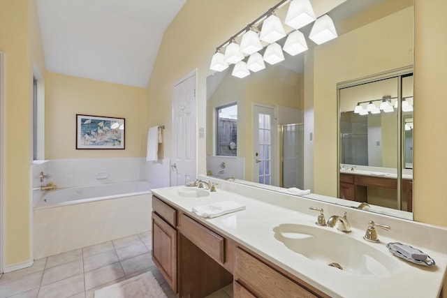 full bath with lofted ceiling, tile patterned floors, a stall shower, a garden tub, and double vanity