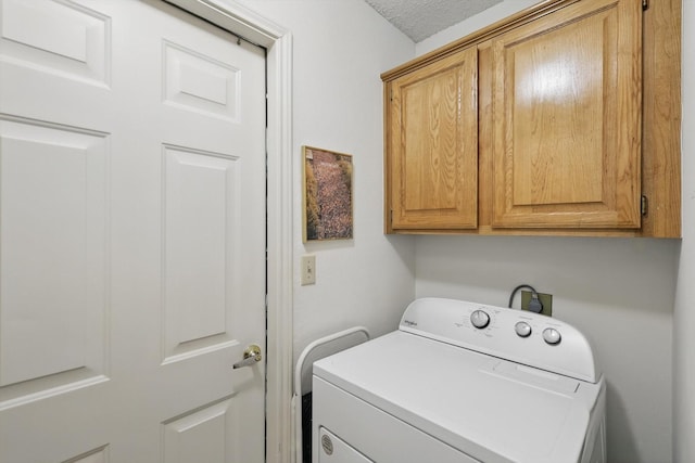 laundry area with washer / clothes dryer and cabinet space