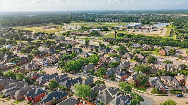 view of property location featuring nearby suburban area and a large body of water