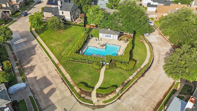 aerial view of residential area with a pool
