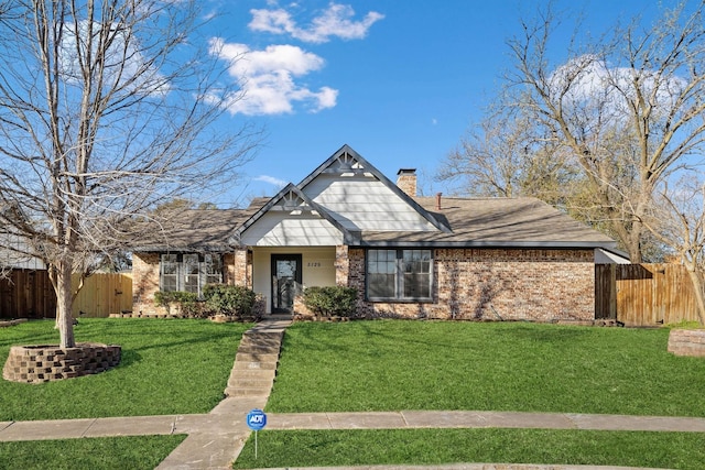 5129 Woodmeadow Ct, Garland, TX 75043 - view of front of property featuring brick siding, a chimney, and roof with shingles