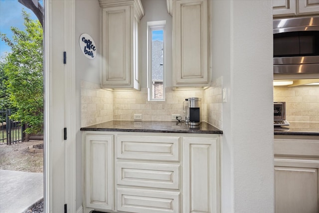 580 Butchart Dr, Prosper, TX 75078 - bar area with stainless steel microwave and tasteful backsplash