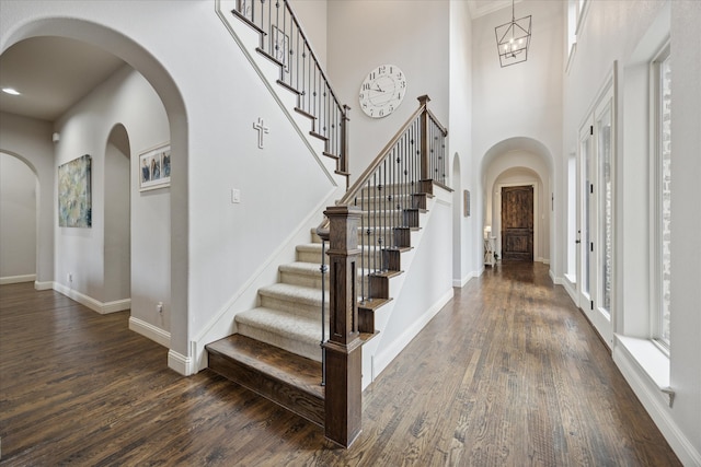 580 Butchart Dr, Prosper, TX 75078 - foyer featuring dark wood-style flooring, baseboards, stairs, and a towering ceiling
